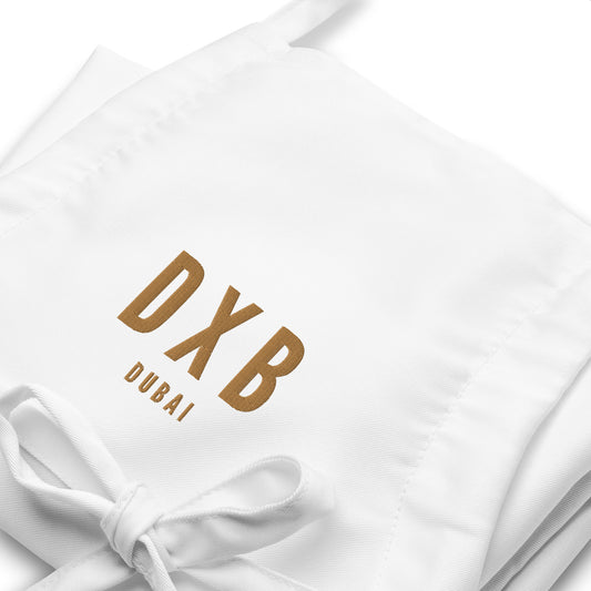DXB Dubai Apron • Airport Code & City Name Embroidered in Old Gold • YHM Designs - Image 02