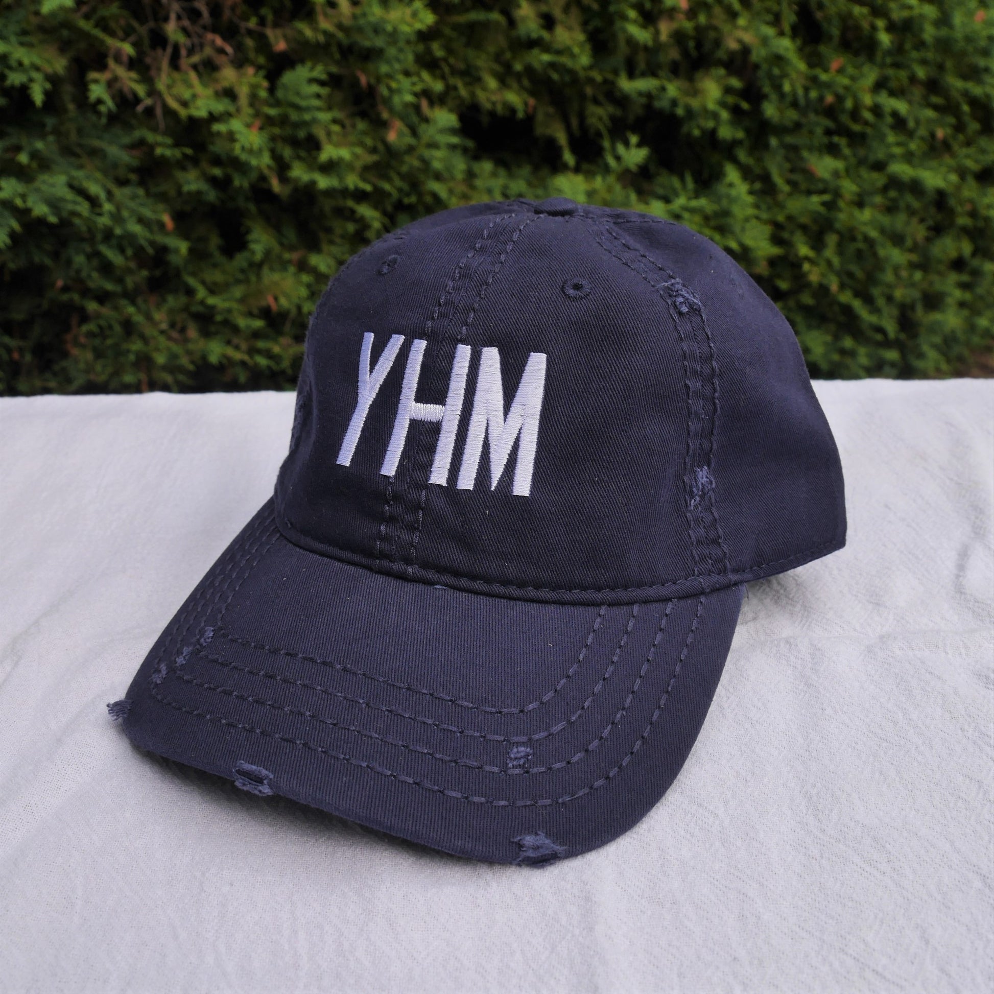 YHM Designs Airport Code Distressed Dad Hat with Air Force Lettering 01
