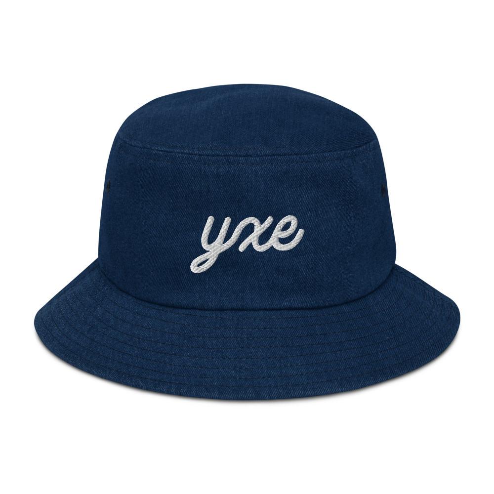 YHM Designs - YXE Saskatoon Airport Code Denim Bucket Hat - Vintage Script Design - White Embroidery - Image 01